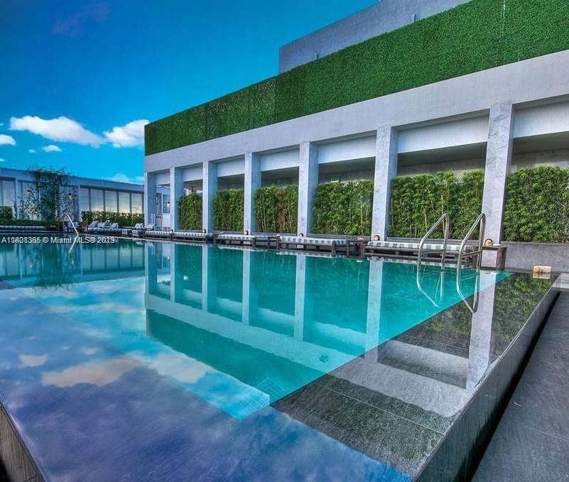 Brickell Miami, FL 33131 - Photo 22 of 25 a view of a house with a backyard