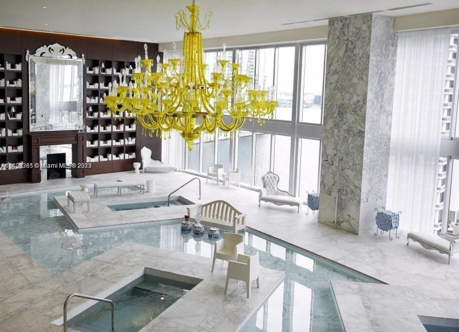 Brickell Miami, FL 33131 - Photo 23 of 25 a living room with fireplace furniture and a large window