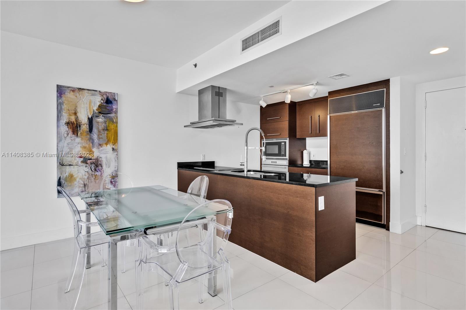 Brickell Miami, FL 33131 - Photo 7 of 25 a living room with stainless steel appliances kitchen island granite countertop furniture and a refrigerator