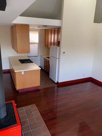 an empty room with wooden floor