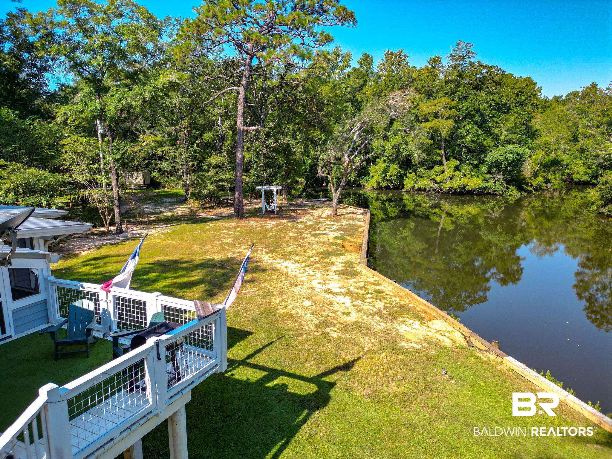 12855 Woodhaven Dairy Road West Silverhill, AL 36576 - Photo 10 of 27 Dock area with a water view and a lawn