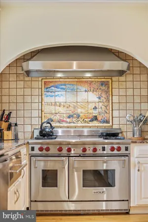 a living room with fireplace furniture and a flat screen tv