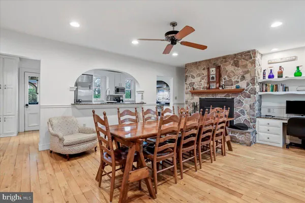 a living room with furniture windows and a wooden floor