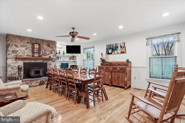 a living room with furniture a chandelier and a chandelier