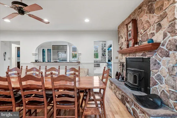 a living room with furniture a table and a chandelier