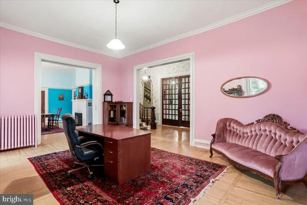 a room with pool table and windows