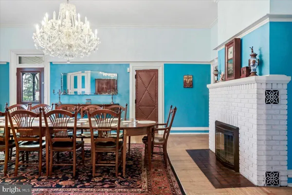 a living room with furniture a flat screen tv and a large window
