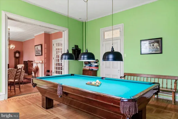 a bedroom with a bed dresser and a flat screen tv