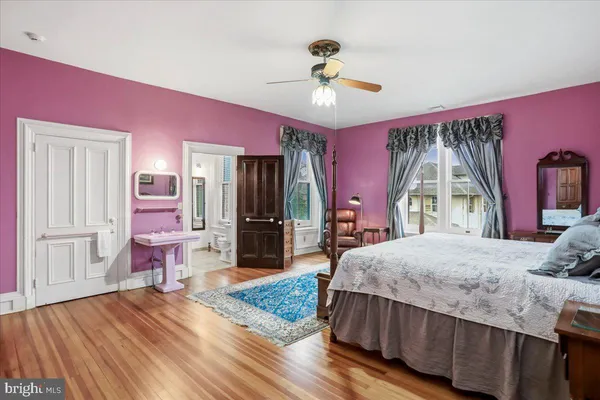 a bathroom with a granite countertop window and a shower