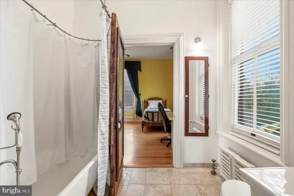 a view of a balcony with wooden floor