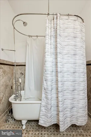 a view of a building with furniture and outdoor seating