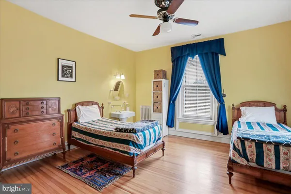 an aerial view of a house with a garden and swimming pool