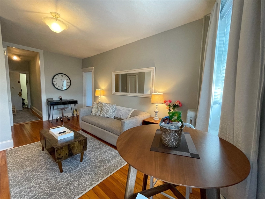 31 Orkney Road, Unit 46 Boston, MA 02135 - Photo 1 of 7 a living room with furniture window and wooden floor