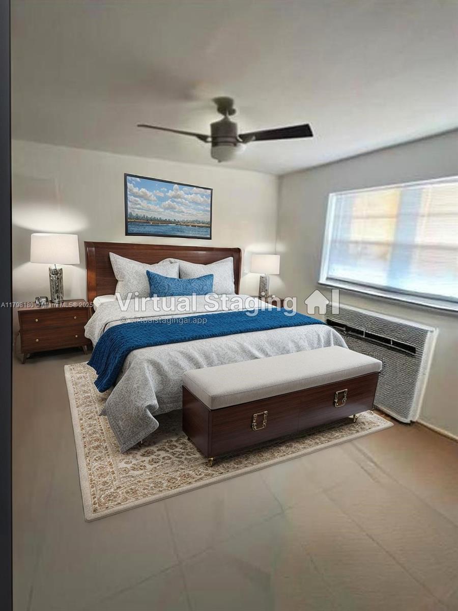 1221 Southwest 122nd Avenue, Unit 401 Miami, FL 33184 - Photo 4 of 22 a bedroom with bed and window