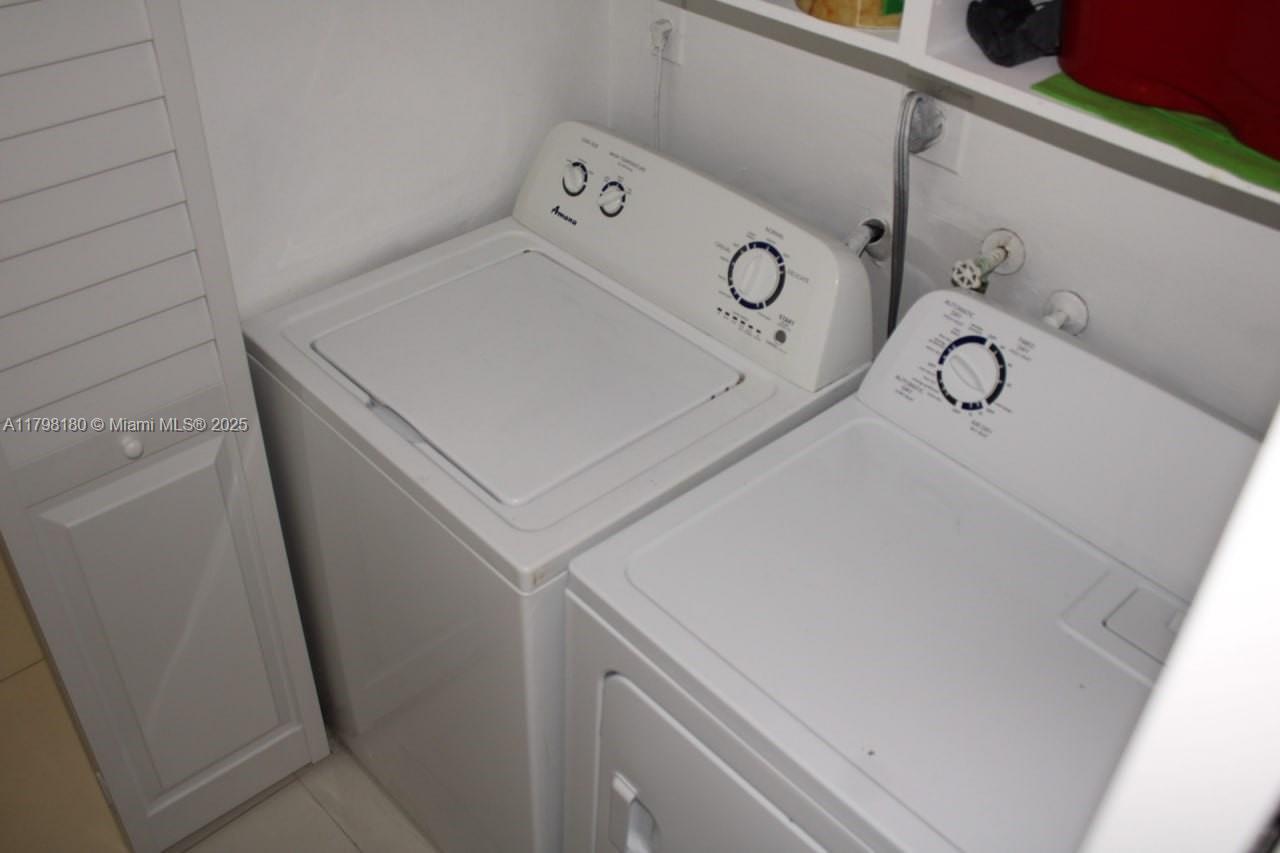 1221 Southwest 122nd Avenue, Unit 401 Miami, FL 33184 - Photo 10 of 22 a utility room with dryer and washer