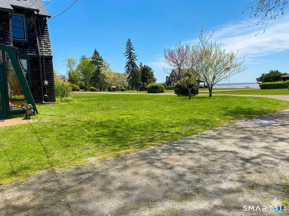 106 Buffalo Bay Road Madison, CT 06443 - Photo 1 of 17 a view of a garden