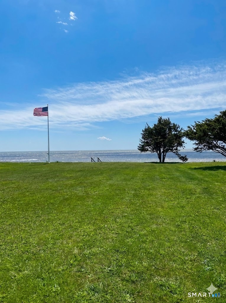106 Buffalo Bay Road Madison, CT 06443 - Photo 2 of 17 a view of an ocean with a big yard