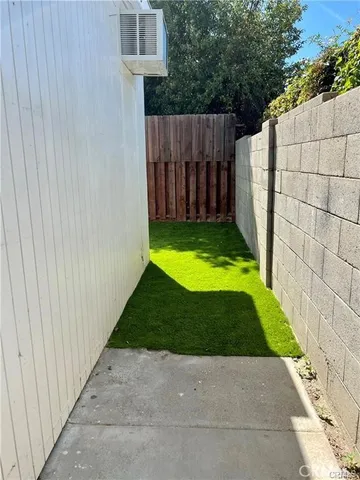 a view of backyard with tub