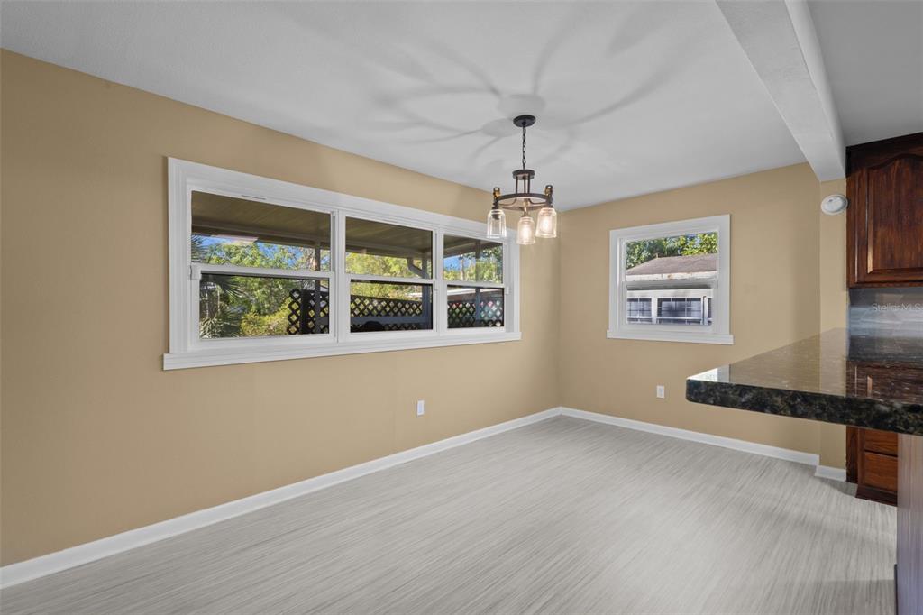 1908 West Fern Street Tampa, FL 33604 - Photo 12 of 47 a view of an empty room with window and wooden floor