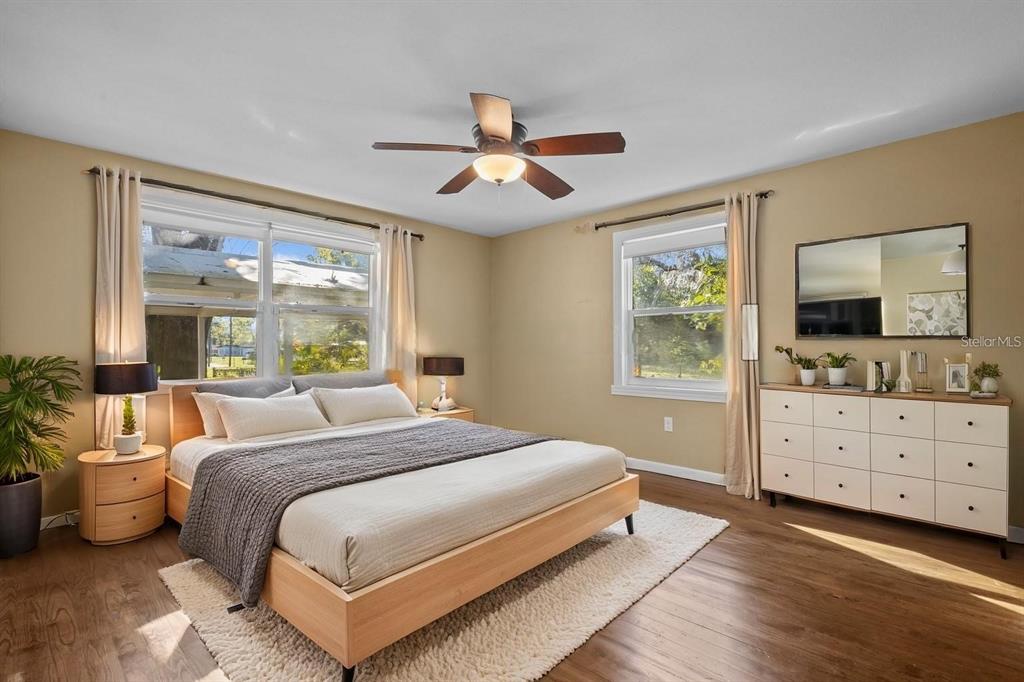 1908 West Fern Street Tampa, FL 33604 - Photo 14 of 47 a bedroom with a large bed and a flat tv screen on dresser