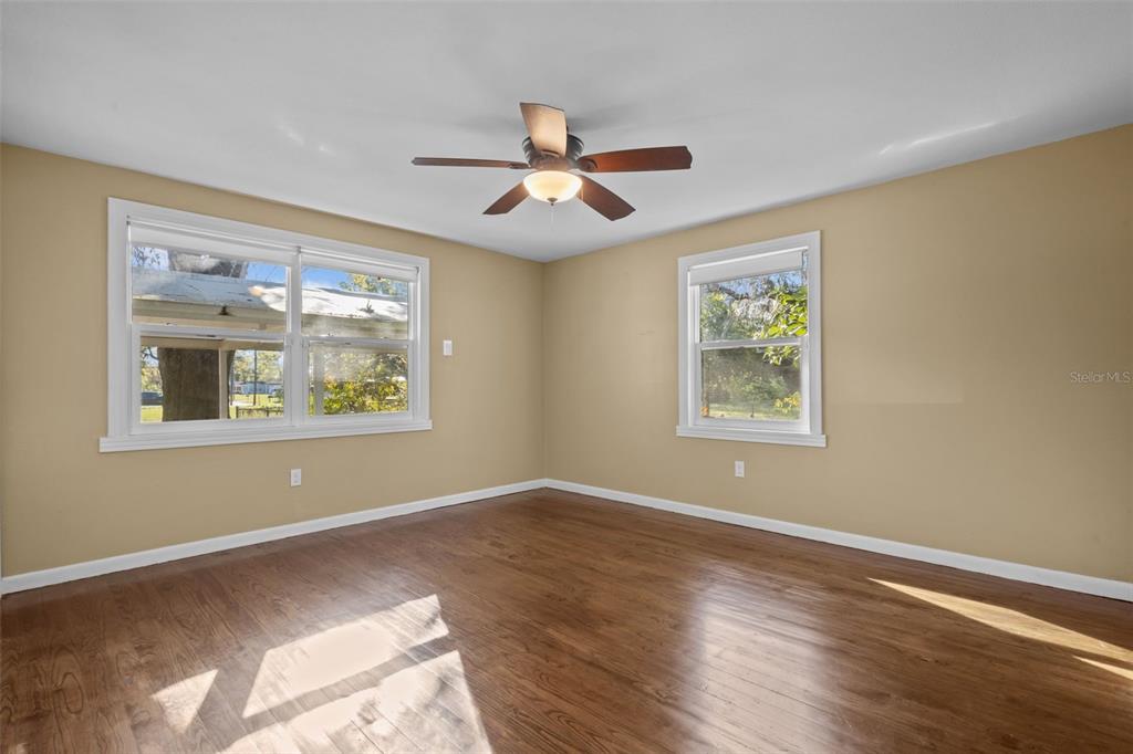 1908 West Fern Street Tampa, FL 33604 - Photo 15 of 47 a view of an empty room with window and wooden floor
