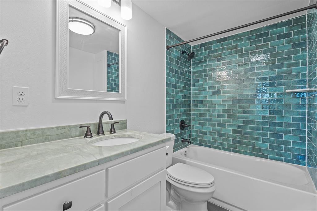 1908 West Fern Street Tampa, FL 33604 - Photo 17 of 47 a bathroom with a sink a toilet and shower