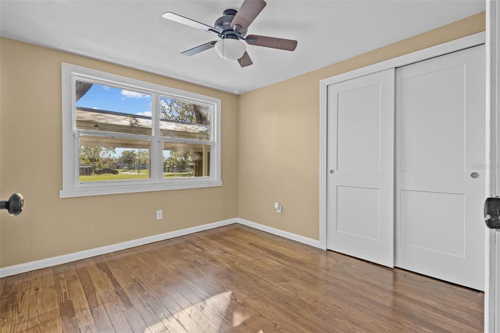 1908 West Fern Street Tampa, FL 33604 - Photo 24 of 47 a view of empty room with wooden floor and fan