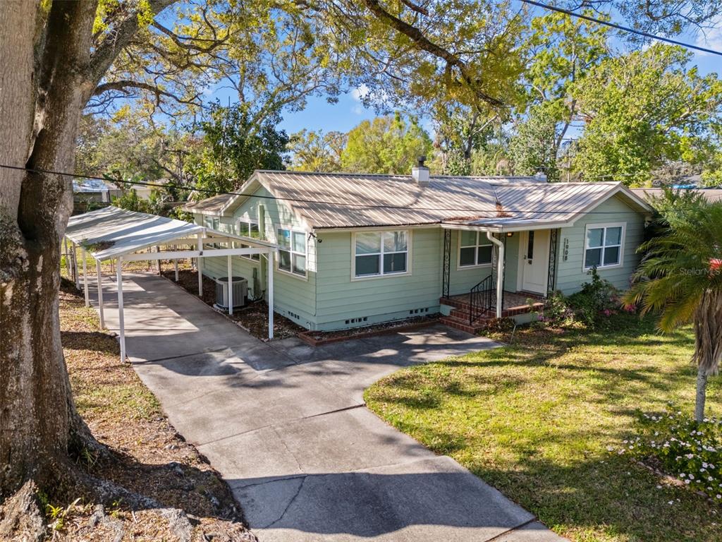 1908 West Fern Street Tampa, FL 33604 - Photo 41 of 47 a view of a house with pool and chairs next to a yard