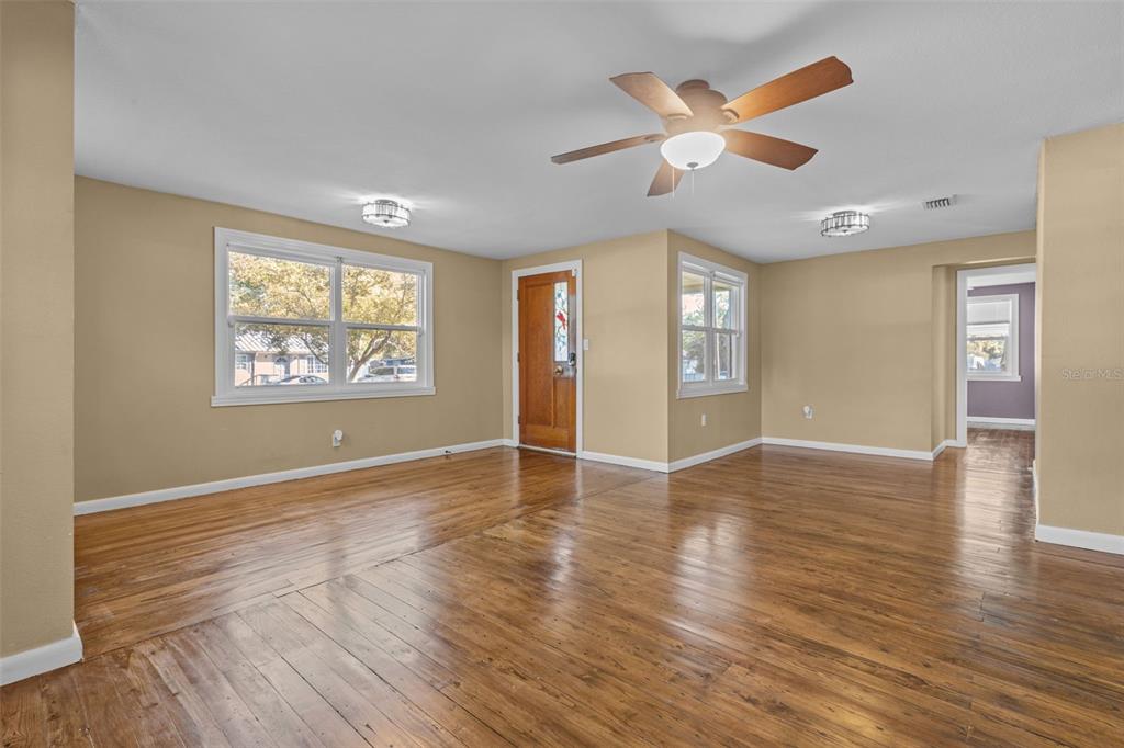 1908 West Fern Street Tampa, FL 33604 - Photo 5 of 47 a view of an empty room with window and wooden floor
