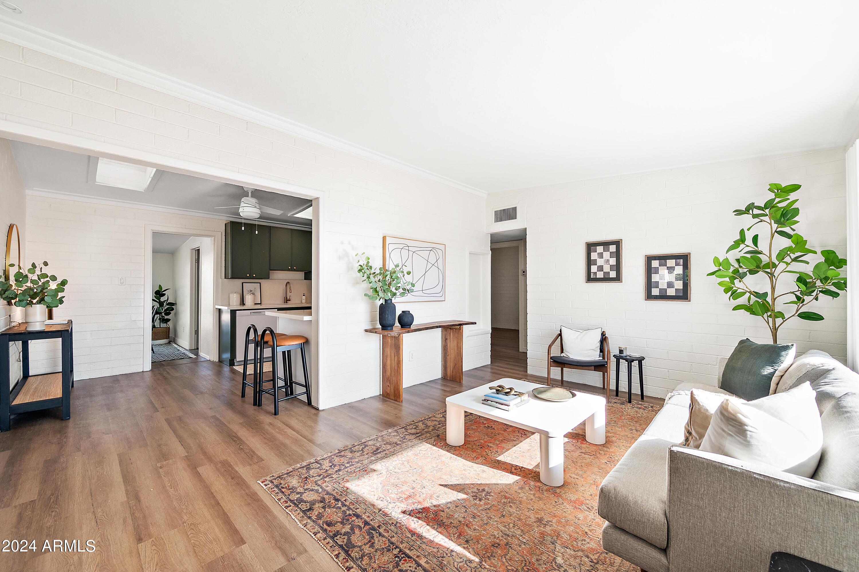 a living room with furniture and a table