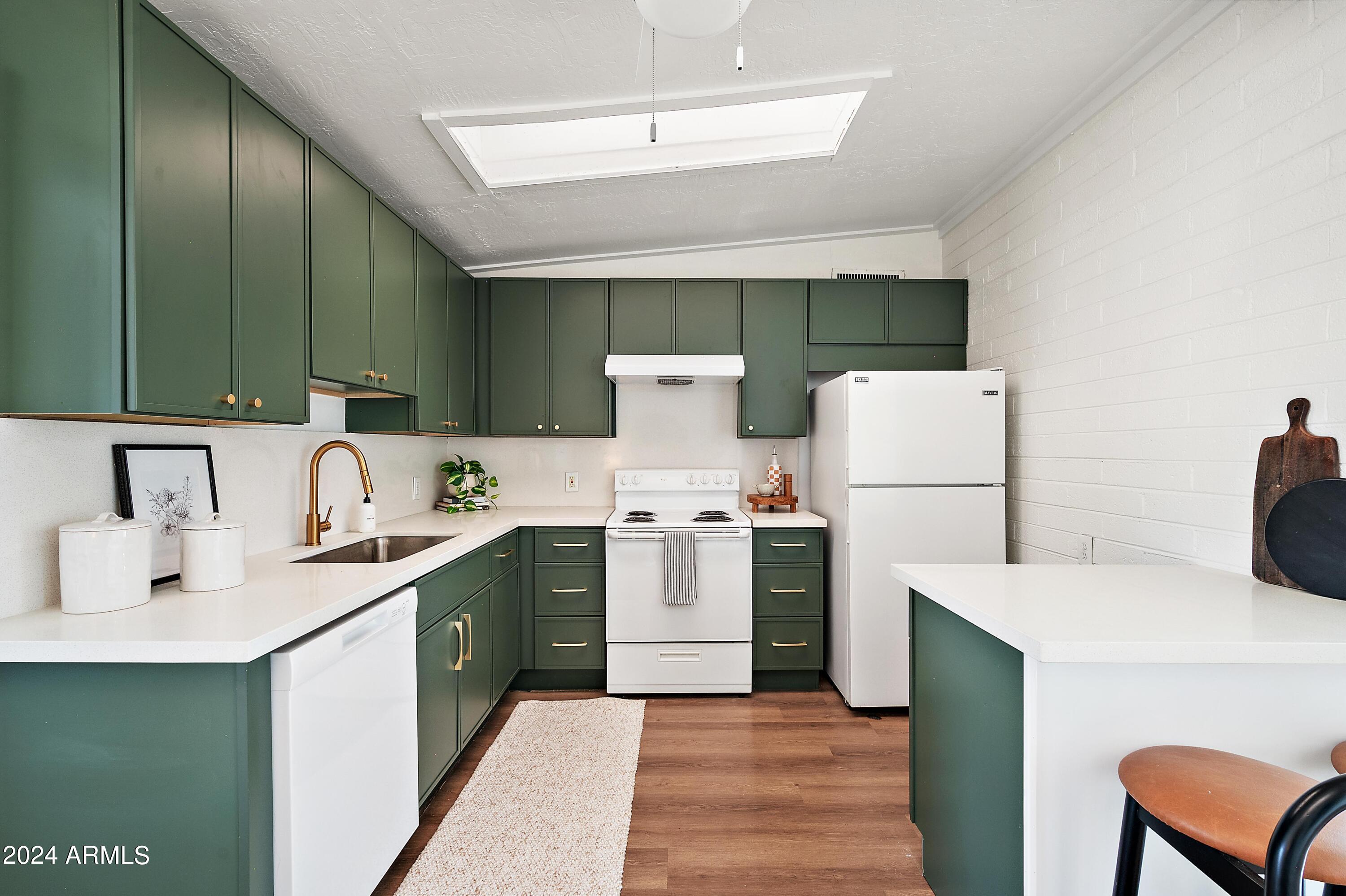 401 South Robert Road Tempe, AZ 85281 - Photo 12 of 35 a kitchen with a sink a stove and a refrigerator