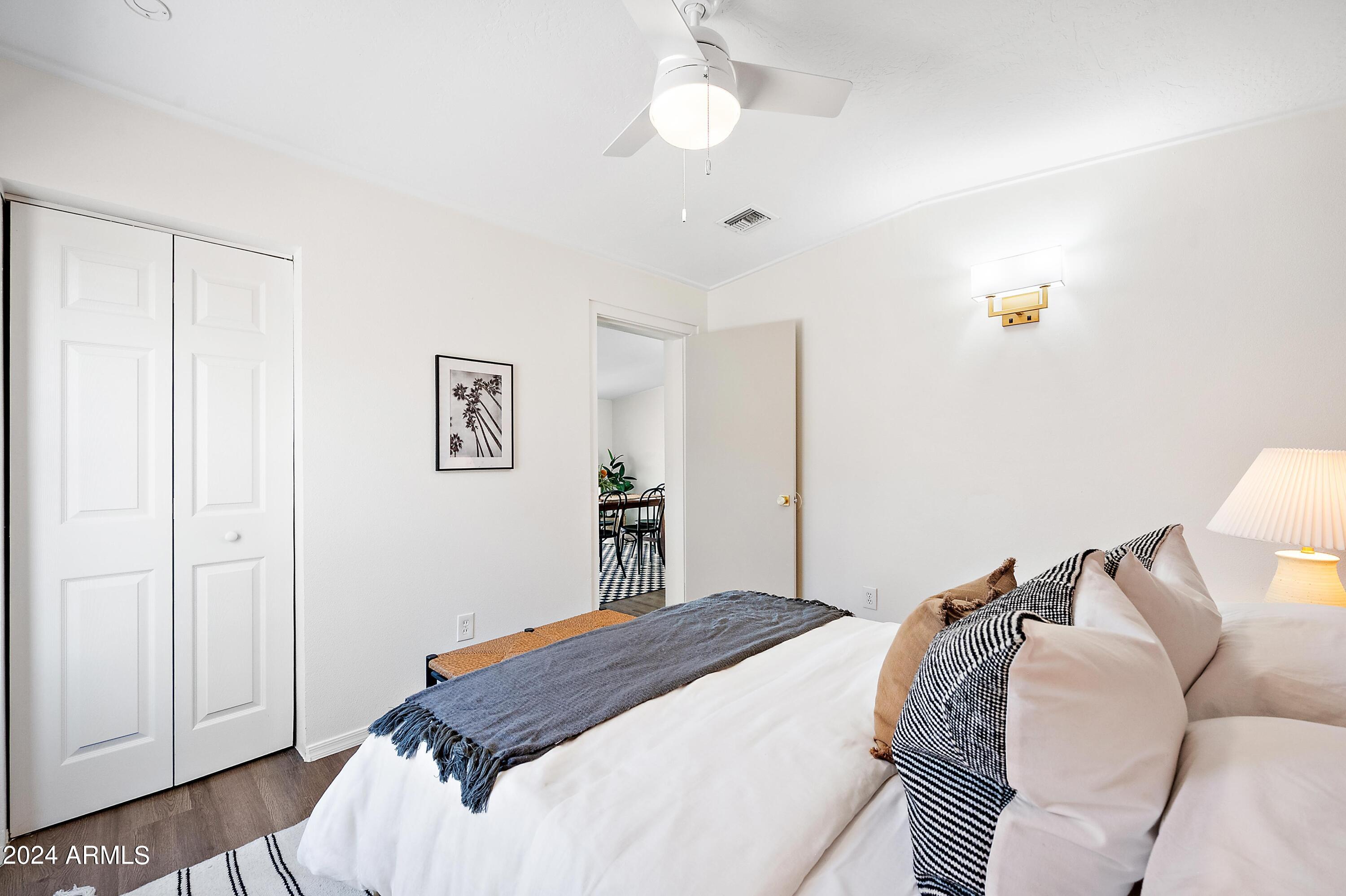 401 South Robert Road Tempe, AZ 85281 - Photo 18 of 35 a bedroom with a bed and a lamp