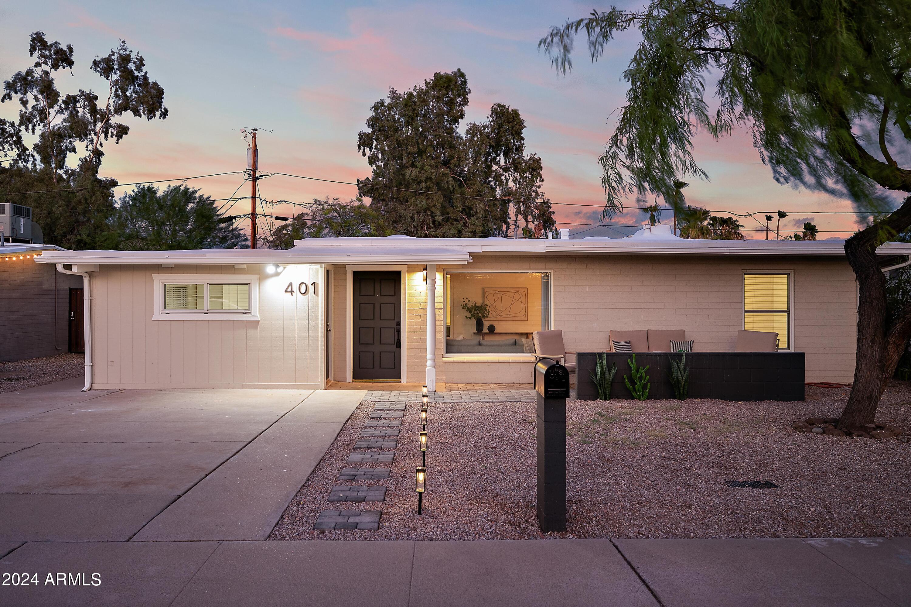 401 South Robert Road Tempe, AZ 85281 - Photo 2 of 35 a front view of a house with garden