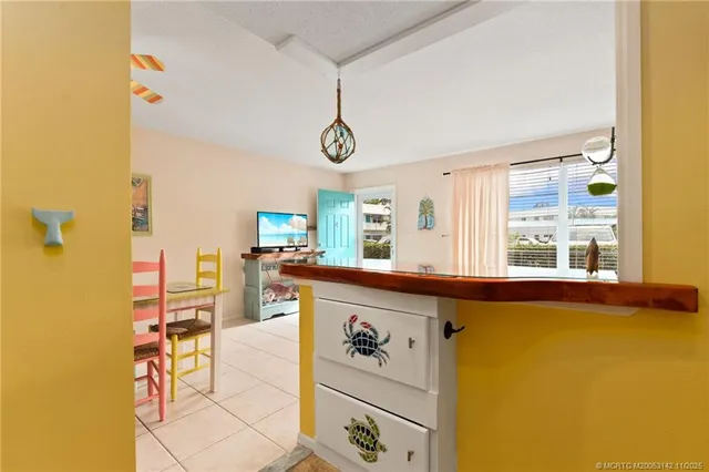a view of a kitchen area with furniture and window