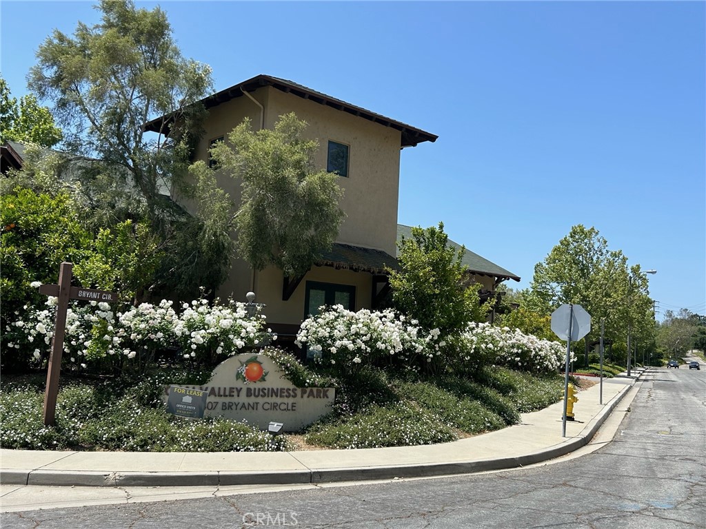 407 Bryant Circle, Unit A Ojai, CA 93023 - Photo 2 of 10 a front view of a house with a yard