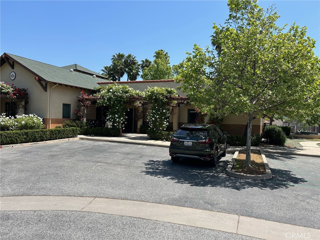 407 Bryant Circle, Unit A Ojai, CA 93023 - Photo 7 of 10 a view of a house with a cars park side of a road