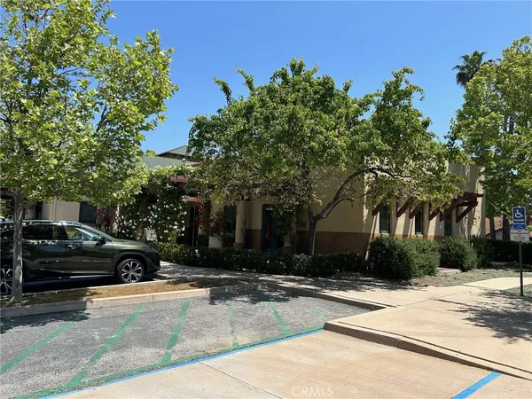 a view of a parked cars in front of a building