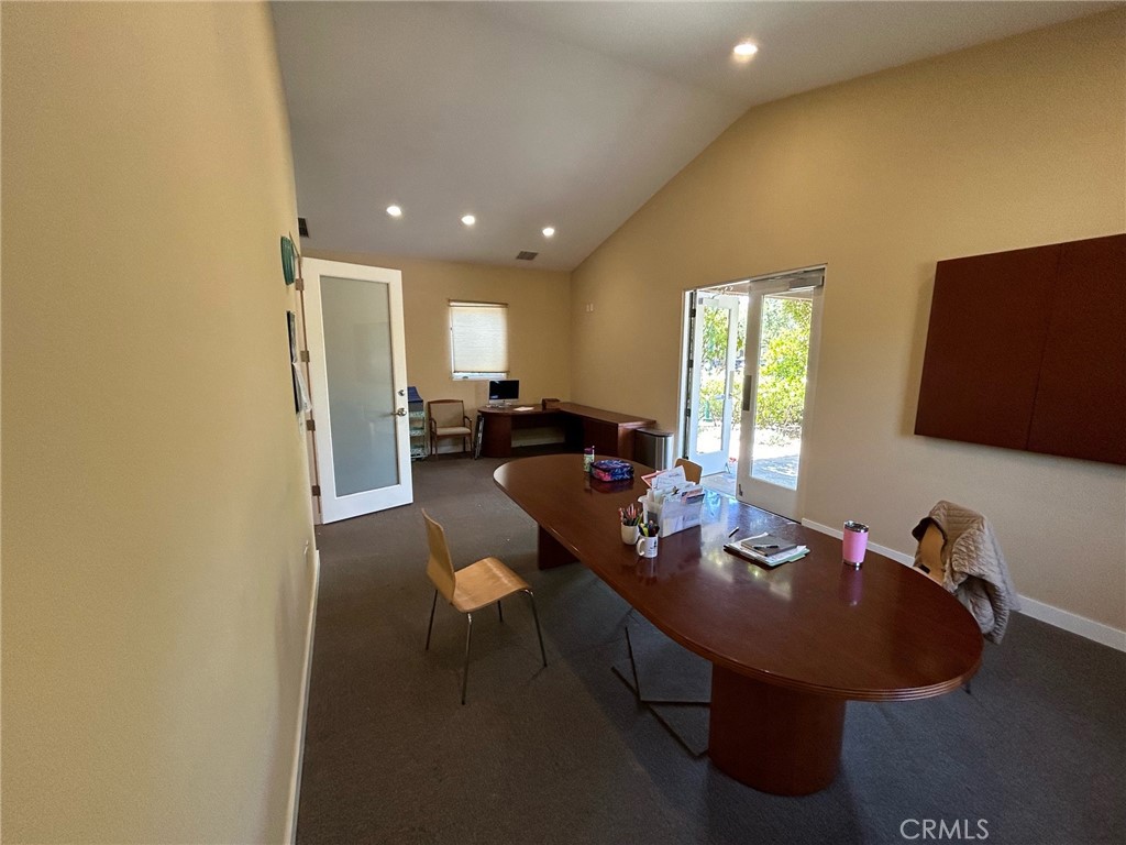 407 Bryant Circle, Unit A Ojai, CA 93023 - Photo 10 of 10 a living room with furniture a flat screen tv and a window