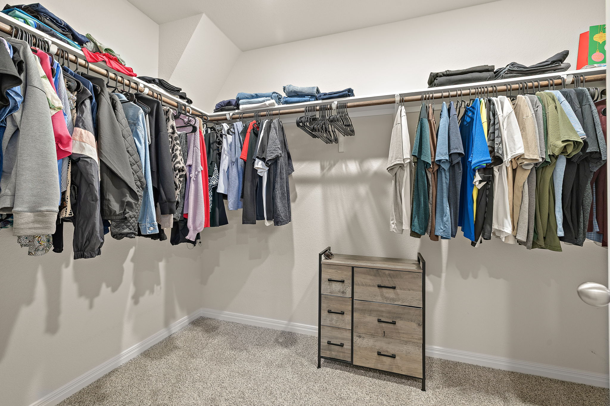 129 Greenway Drive Georgetown, TX 78628 - Photo 15 of 22 a view of walk in closet with clothes