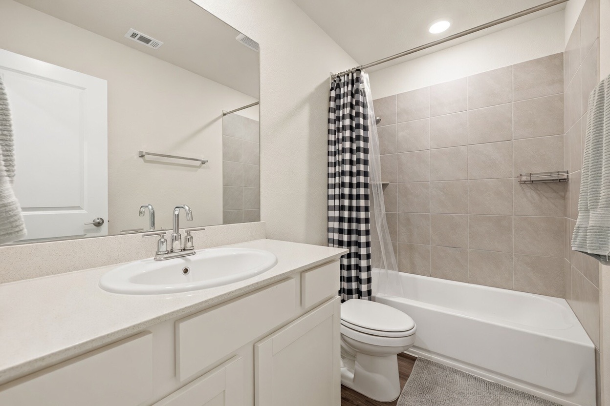129 Greenway Drive Georgetown, TX 78628 - Photo 17 of 22 a bathroom with a sink toilet and shower