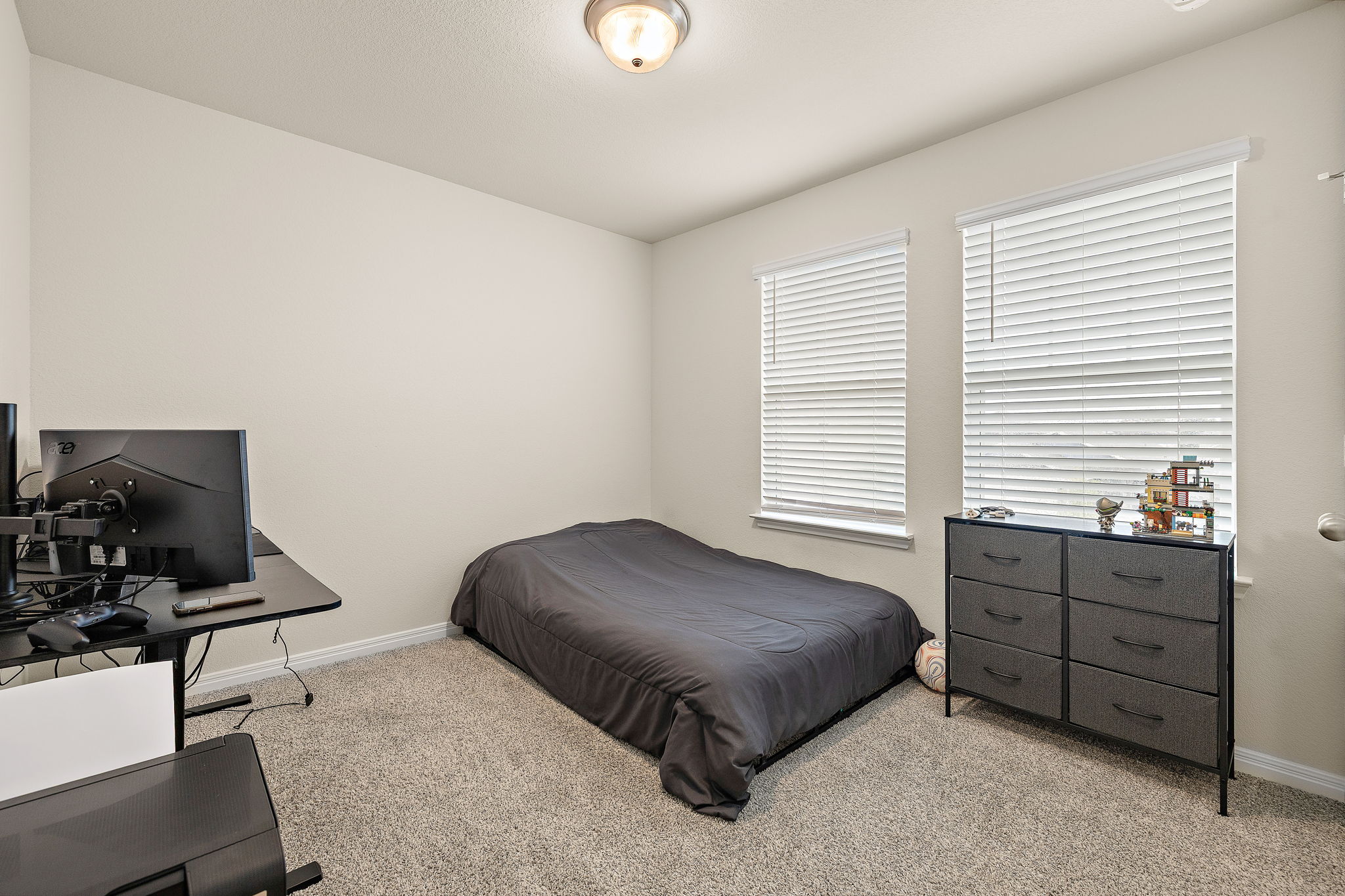 129 Greenway Drive Georgetown, TX 78628 - Photo 18 of 22 a bedroom with a bed and a potted plant