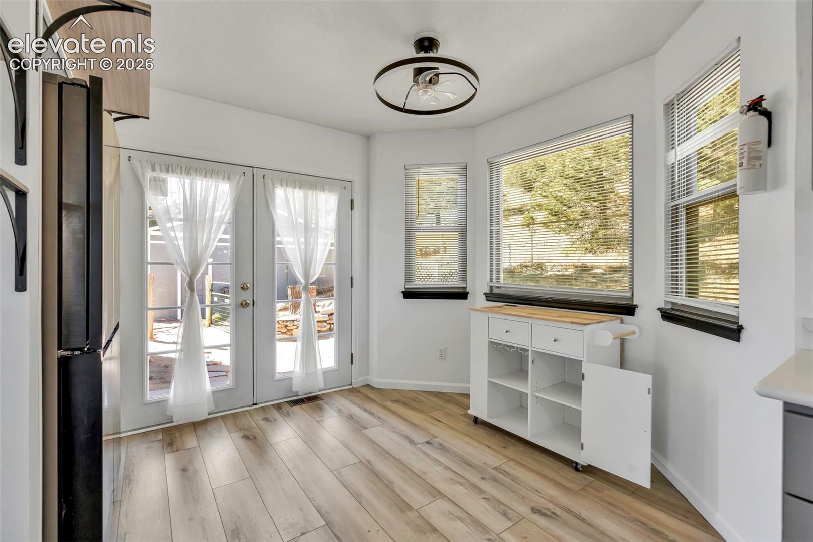 17370 Sweet Road Peyton, CO 80831 - Photo 25 of 47 Lots of natural light in this home, clean and cute. Breakfast nook for your table and french door access to the back yard.