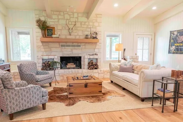 a living room with furniture and a fireplace
