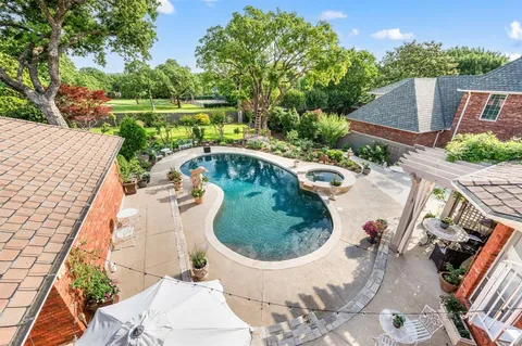 an aerial view of a house with outdoor space