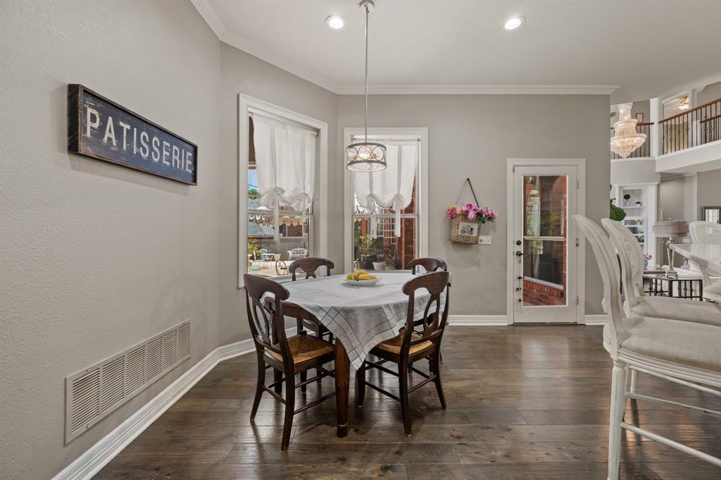 2906 Edgewood Lane Colleyville, TX 76034 - Photo 17 of 40 a view of a dining room with furniture and wooden floor