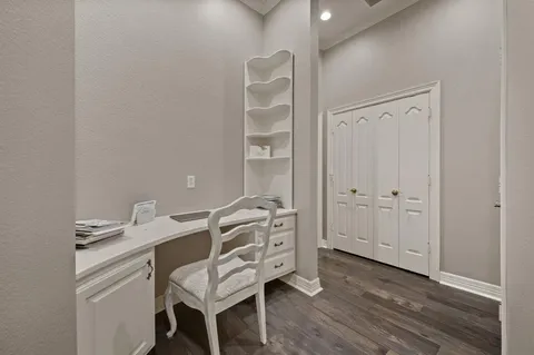 a view of a workspace with furniture