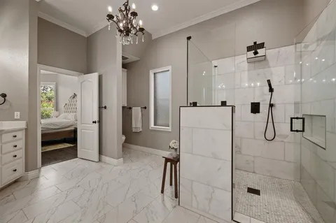 a spacious bathroom with a shower and a sink
