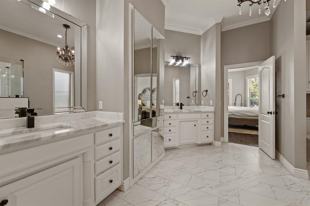 2906 Edgewood Lane Colleyville, TX 76034 - Photo 26 of 40 a spacious bathroom with a granite countertop sink a toilet and a mirror
