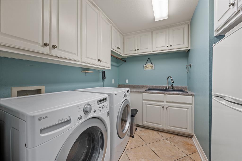2906 Edgewood Lane Colleyville, TX 76034 - Photo 37 of 40 a utility room with dryer and washer