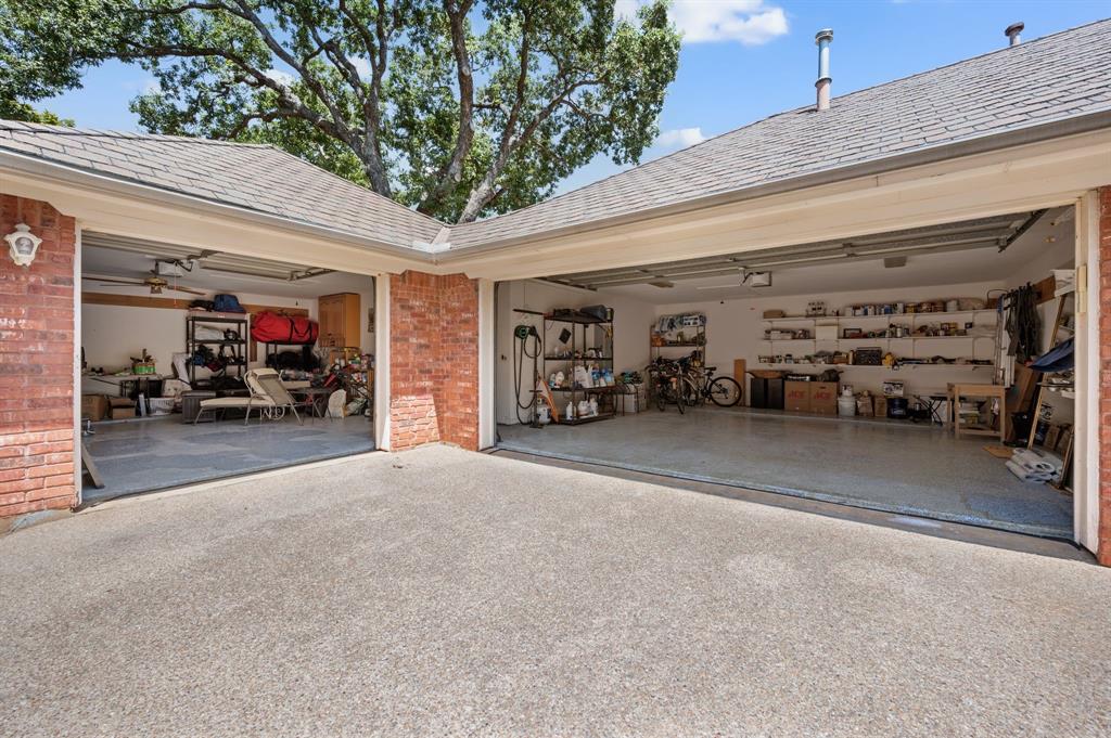 2906 Edgewood Lane Colleyville, TX 76034 - Photo 38 of 40 a view of a garage with cars